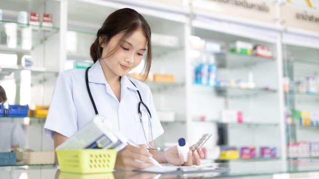 women reading a checklist of medcine